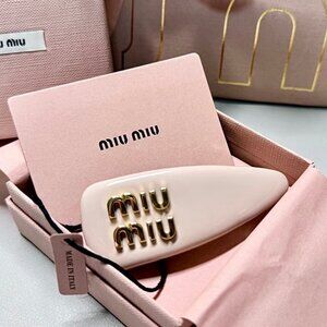 MIUMIU patent leather hair clip for women